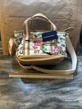 Aeropostale White Canvas Crossbody Satchel with Tan Trim and Multicolor Graphics